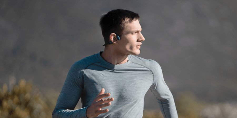 Runner wearing Shokz headphones