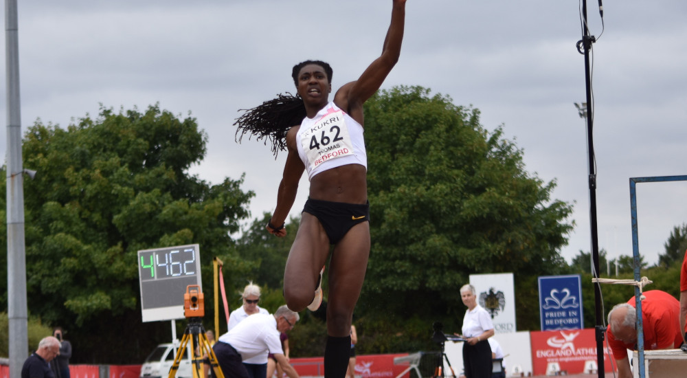 Athlete competing in long jump at the England Athletics Senior and Disability Championships in Bedford