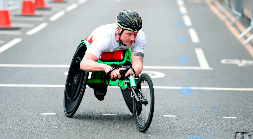 Simon Lawson competing in the wheelchair marathon for Team England at the Commonwealth Games